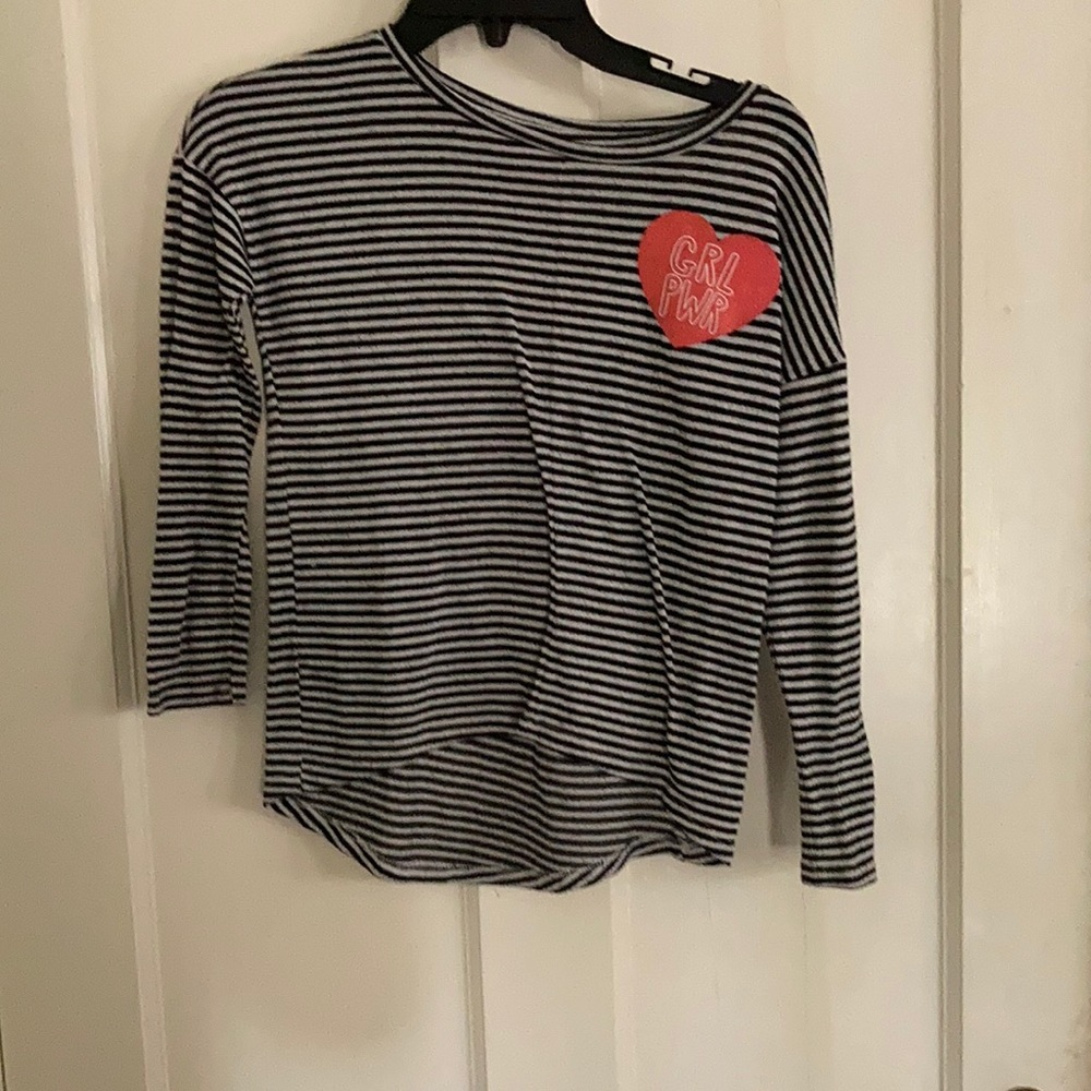 Long sleeve black and white striped tee shirt.